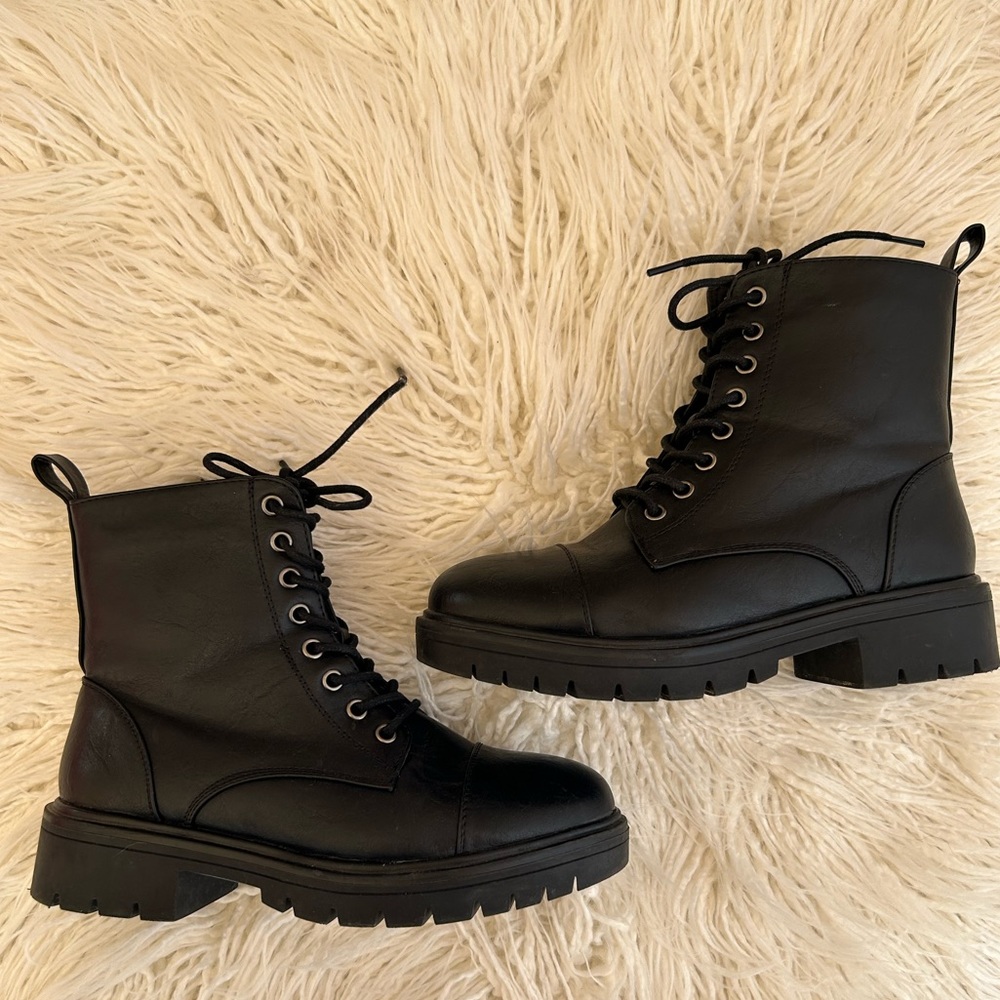 Women’s black combat boots in size 8